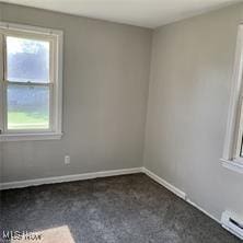 181 E Judson Ave, Youngstown, OH 44507 - spare room featuring healthy amount of natural light and baseboard heating