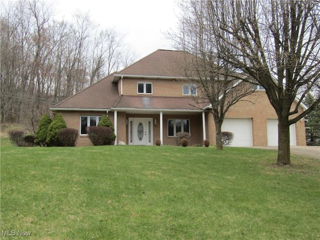 230 Bryden Rd, Weirton, WV 26062 - view of front of property with a shingled roof, a garage, brick siding, a front lawn, and driveway