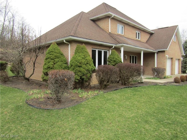 230 Bryden Rd, Weirton, WV 26062 - view of front of property featuring brick siding, a front lawn, and an attached garage