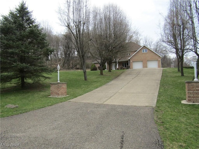 230 Bryden Rd, Weirton, WV 26062 - view of front of house featuring a front yard, a garage, and concrete driveway
