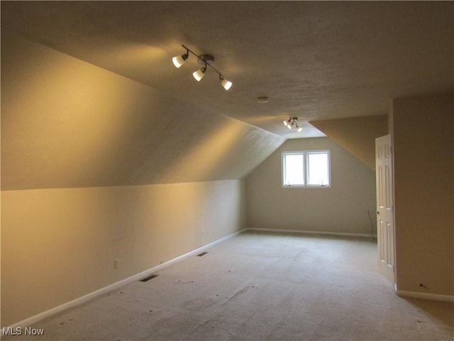 230 Bryden Rd, Weirton, WV 26062 - bonus room with visible vents, baseboards, a textured ceiling, and lofted ceiling