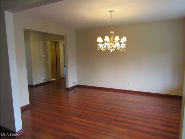 230 Bryden Rd, Weirton, WV 26062 - spare room with a chandelier, dark wood-style flooring, baseboards, and visible vents