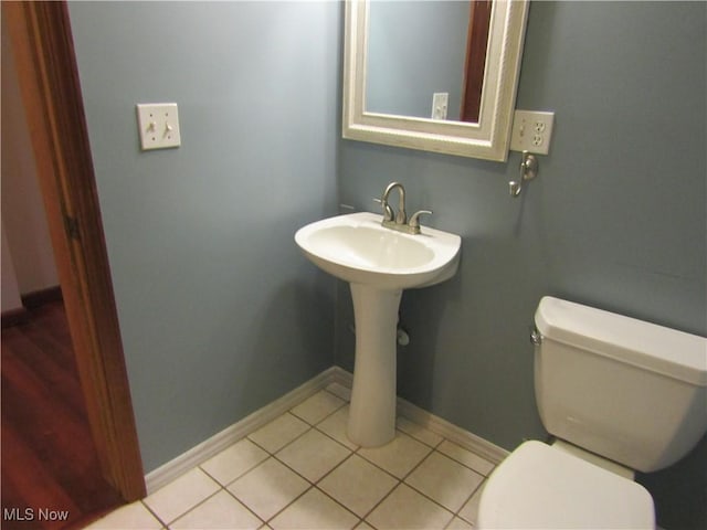 230 Bryden Rd, Weirton, WV 26062 - half bathroom featuring tile patterned flooring, baseboards, and toilet