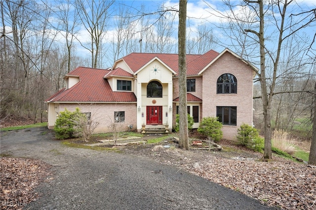 view of front of house with brick siding