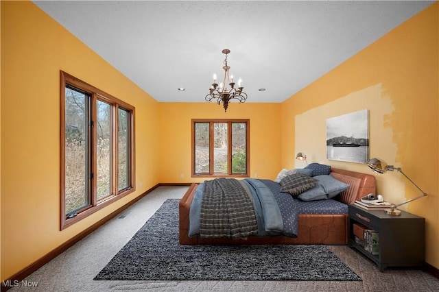 bedroom with a chandelier, visible vents, baseboards, and carpet