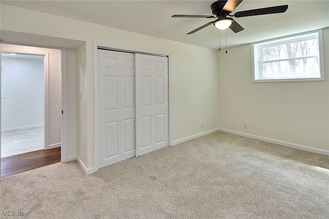 unfurnished bedroom with a ceiling fan, baseboards, carpet floors, and a closet