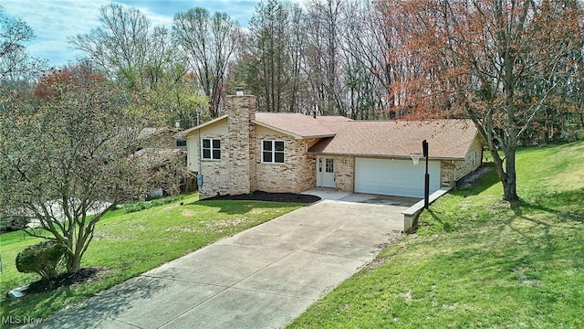 ranch-style home featuring an attached garage, driveway, a chimney, and a front lawn