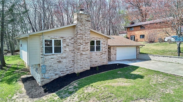 view of side of property with an attached garage, a lawn, a chimney, and concrete driveway