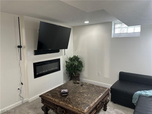 15304 Bartlett Ave, Cleveland, OH 44120 - living area with baseboards, carpet floors, a glass covered fireplace, and recessed lighting