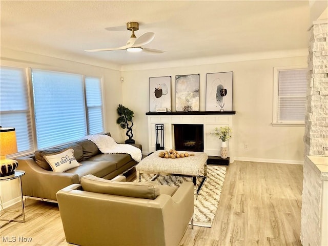 15304 Bartlett Ave, Cleveland, OH 44120 - living room featuring a fireplace, ceiling fan, and wood finished floors