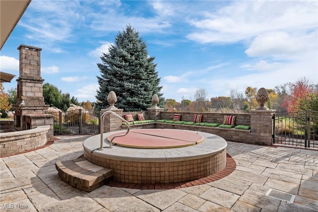 2142 State St NW, Uniontown, OH 44685 - view of patio with fence, visible vents, and an outdoor fireplace