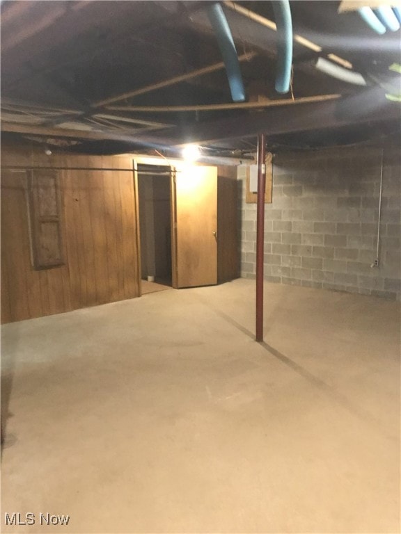 unfinished below grade area with wooden walls