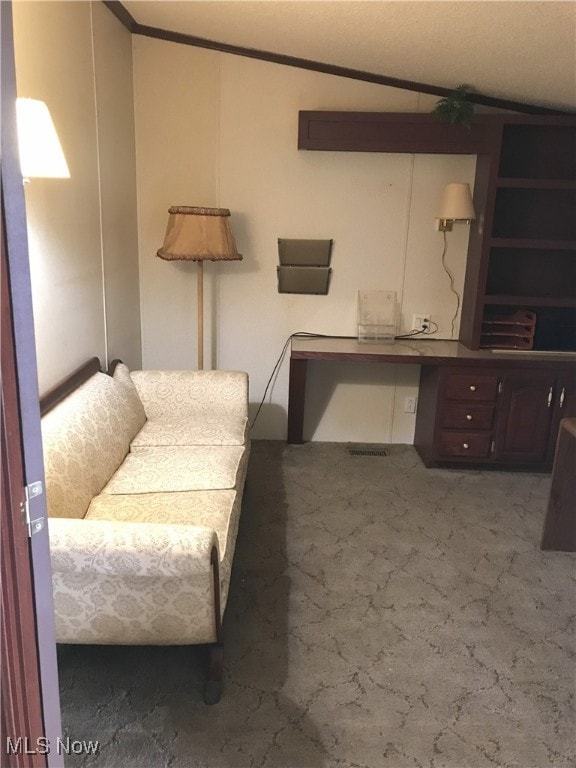 living area with crown molding