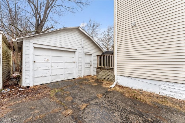 detached garage with aphalt driveway