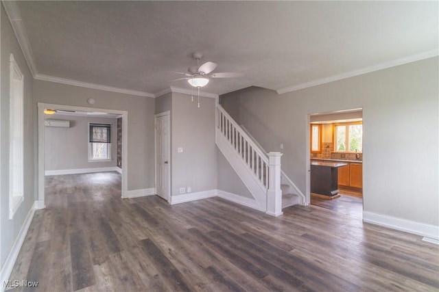 unfurnished living room with crown molding, dark wood-style flooring, a ceiling fan, and stairway