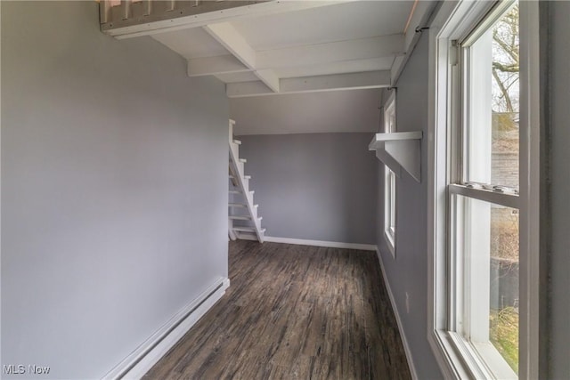 interior space with baseboards, dark wood-style floors, beam ceiling, and stairway