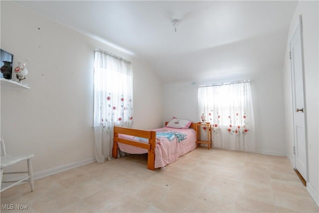 bedroom with vaulted ceiling