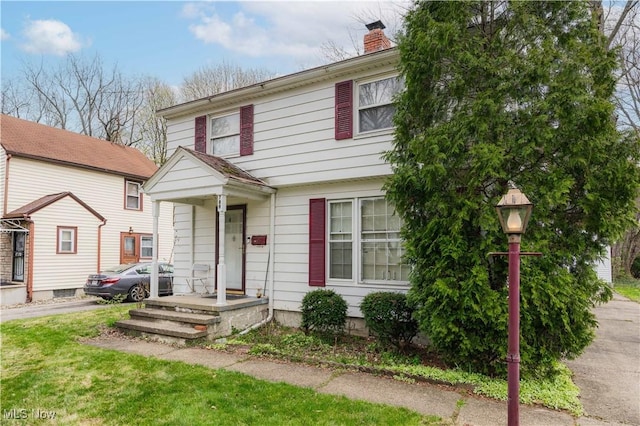 view of front of home with a chimney