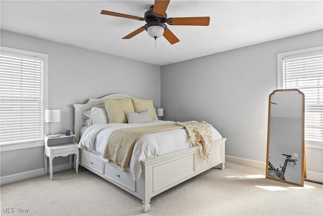 218 Canterbury Ct, Columbiana, OH 44408 - bedroom featuring light carpet, baseboards, and multiple windows