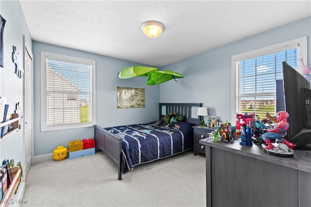 218 Canterbury Ct, Columbiana, OH 44408 - carpeted bedroom with a textured ceiling and baseboards