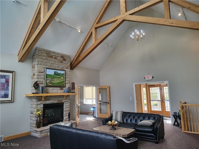 218 Canterbury Ct, Columbiana, OH 44408 - living room with carpet flooring, a stone fireplace, and beamed ceiling