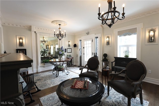 128 Center St, Milan, OH 44846 - living area featuring wood finished floors, a chandelier, and baseboards