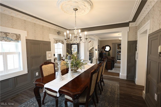 128 Center St, Milan, OH 44846 - dining room featuring a chandelier, crown molding, dark wood-style floors, and wallpapered walls