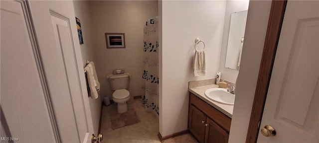 bathroom with baseboards, a shower with shower curtain, toilet, vanity, and tile patterned floors