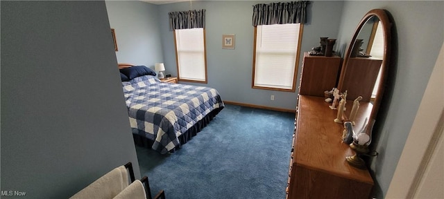 bedroom featuring carpet flooring and baseboards