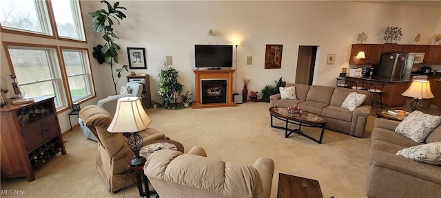 4209 Majorna Dr, West Salem, OH 44287 - living room with light colored carpet, healthy amount of natural light, and a fireplace with raised hearth