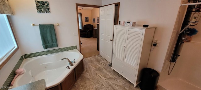 bathroom with walk in shower and a tub with jets