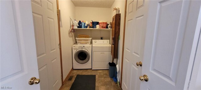 4209 Majorna Dr, West Salem, OH 44287 - laundry area featuring separate washer and dryer and a textured ceiling