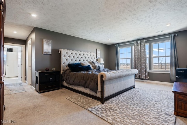 5454 Schueller Blvd, Sheffield Village, OH 44054 - bedroom featuring light carpet, recessed lighting, baseboards, and a textured ceiling