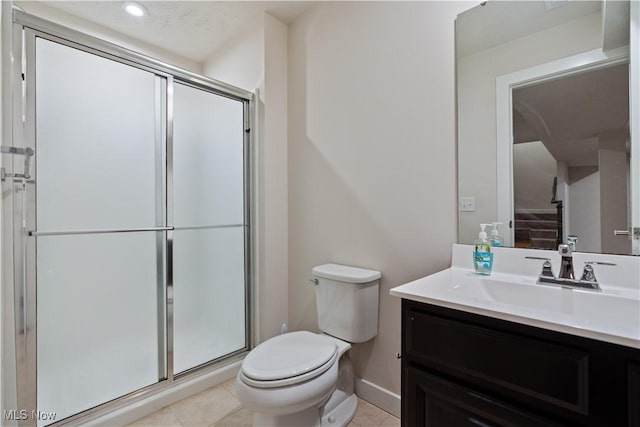 5454 Schueller Blvd, Sheffield Village, OH 44054 - full bath with vanity, baseboards, tile patterned flooring, toilet, and a shower stall