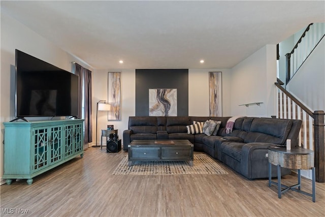 5454 Schueller Blvd, Sheffield Village, OH 44054 - living room featuring baseboards, recessed lighting, wood finished floors, and stairs