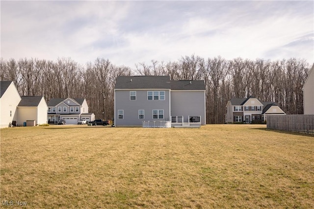 5454 Schueller Blvd, Sheffield Village, OH 44054 - back of house with central AC unit and a lawn
