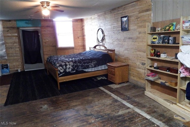 39 E Main St, Crooksville, OH 43731 - bedroom featuring wood-type flooring and wooden walls