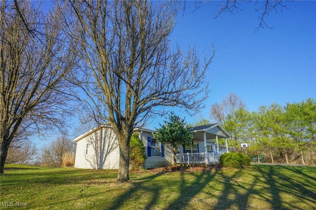 8672 Ridgeview Rd, Chandlersville, OH 43727 - exterior space featuring a porch and a front yard