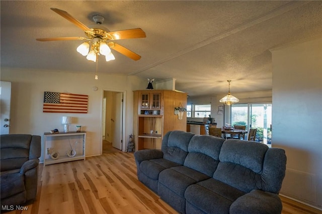 8672 Ridgeview Rd, Chandlersville, OH 43727 - living area featuring a textured ceiling, ceiling fan, and light wood-type flooring