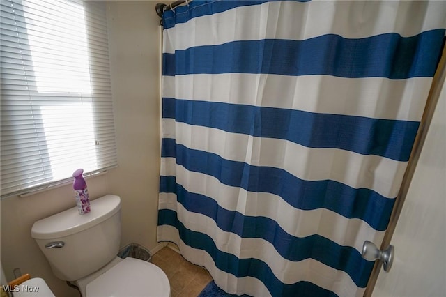 8672 Ridgeview Rd, Chandlersville, OH 43727 - bathroom with curtained shower, toilet, and tile patterned flooring