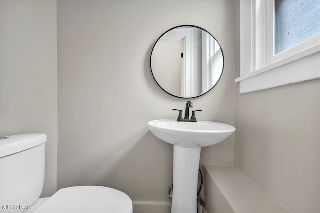bathroom with a sink and toilet