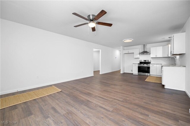 1996 E Oldgate Rd, Sandusky, OH 44870 - unfurnished living room featuring a sink, ceiling fan, baseboards, and dark wood-style floors