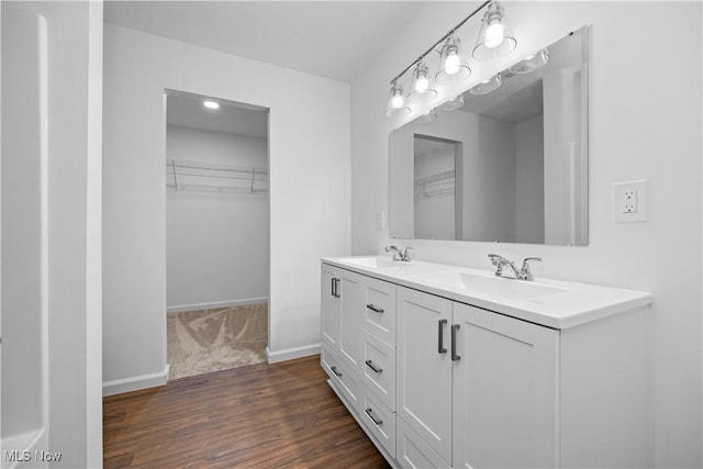 1996 E Oldgate Rd, Sandusky, OH 44870 - bathroom with double vanity, a sink, and a walk in closet
