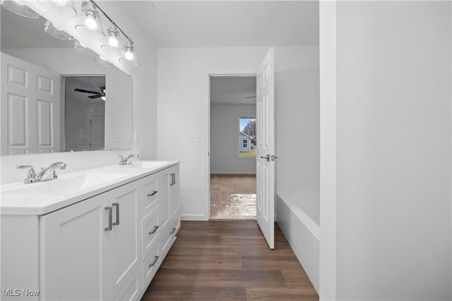 1996 E Oldgate Rd, Sandusky, OH 44870 - full bath featuring double vanity, a sink, and wood finished floors