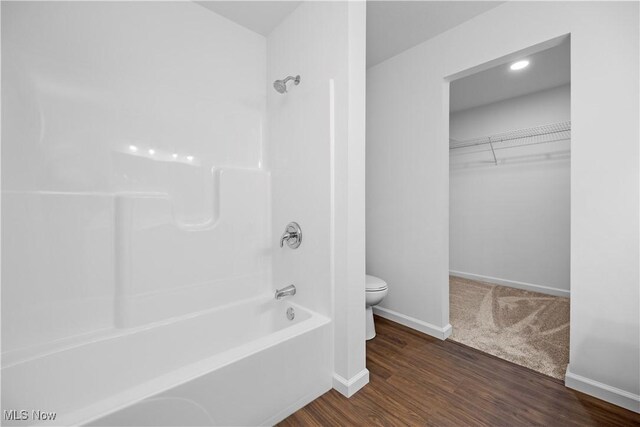 1996 E Oldgate Rd, Sandusky, OH 44870 - full bath featuring shower / tub combination, a spacious closet, toilet, wood finished floors, and baseboards