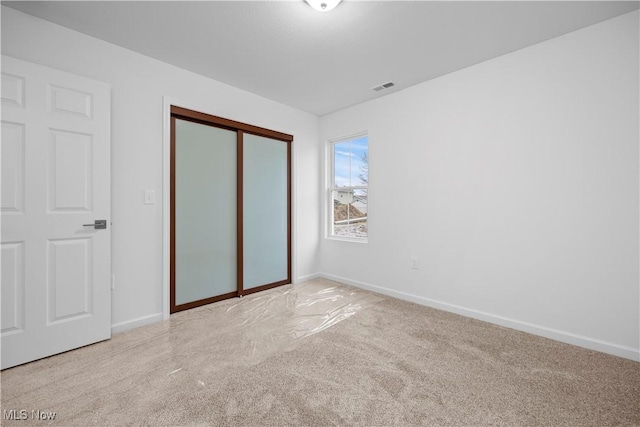 1996 E Oldgate Rd, Sandusky, OH 44870 - unfurnished bedroom featuring baseboards, carpet, and visible vents