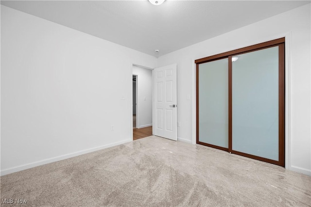 1996 E Oldgate Rd, Sandusky, OH 44870 - unfurnished bedroom with a closet, carpet flooring, and baseboards