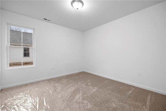 1996 E Oldgate Rd, Sandusky, OH 44870 - carpeted empty room with baseboards and visible vents