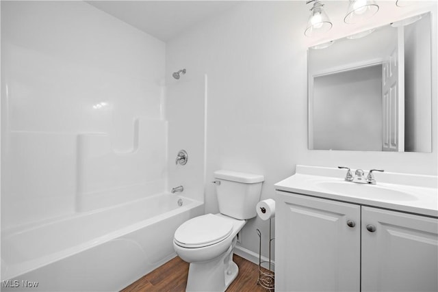 1996 E Oldgate Rd, Sandusky, OH 44870 - full bathroom with shower / washtub combination, vanity, toilet, wood finished floors, and baseboards