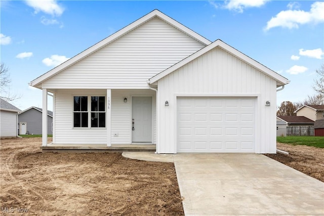 1996 E Oldgate Rd, Sandusky, OH 44870 - single story home featuring board and batten siding, an attached garage, and driveway